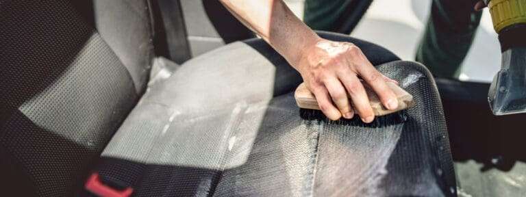 cleaning car seats with brush