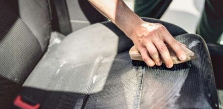 cleaning car seats with brush